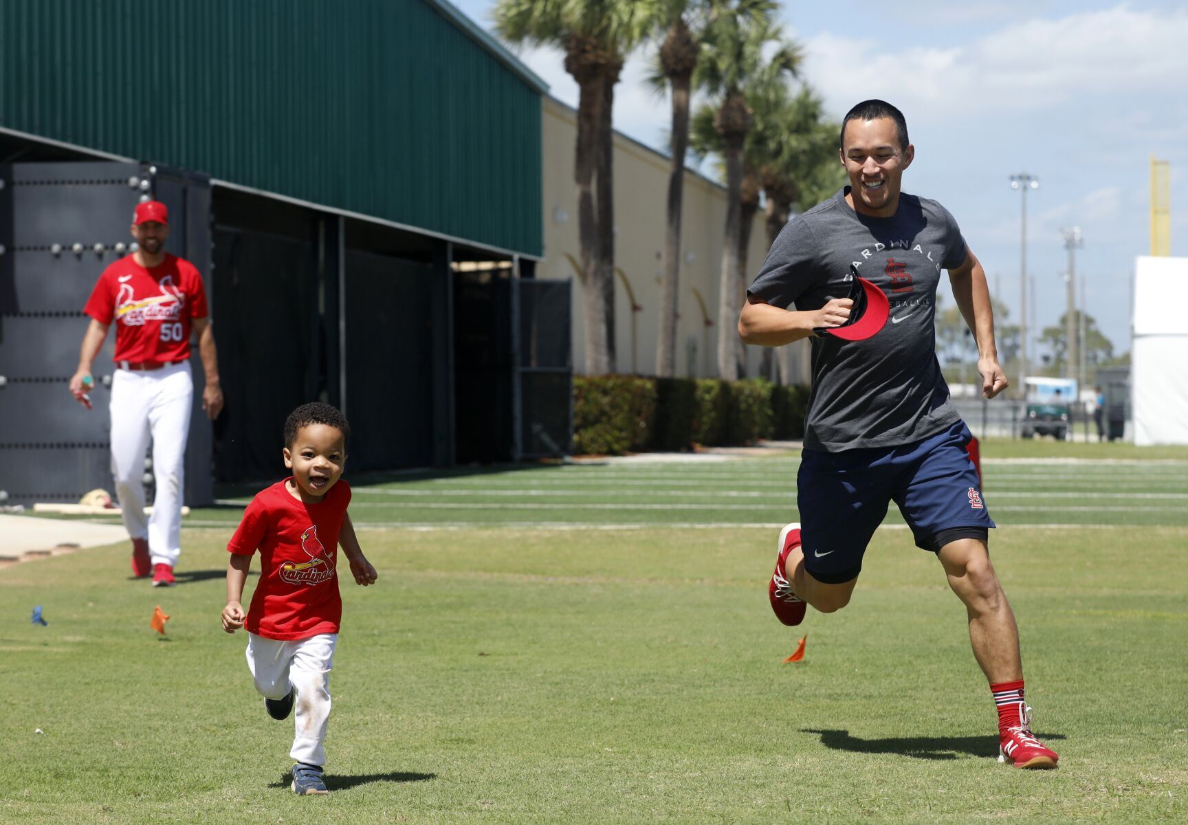 St. Louis Cardinals catcher Yadier Molina arrives on day 8 of team workouts in Jupiter